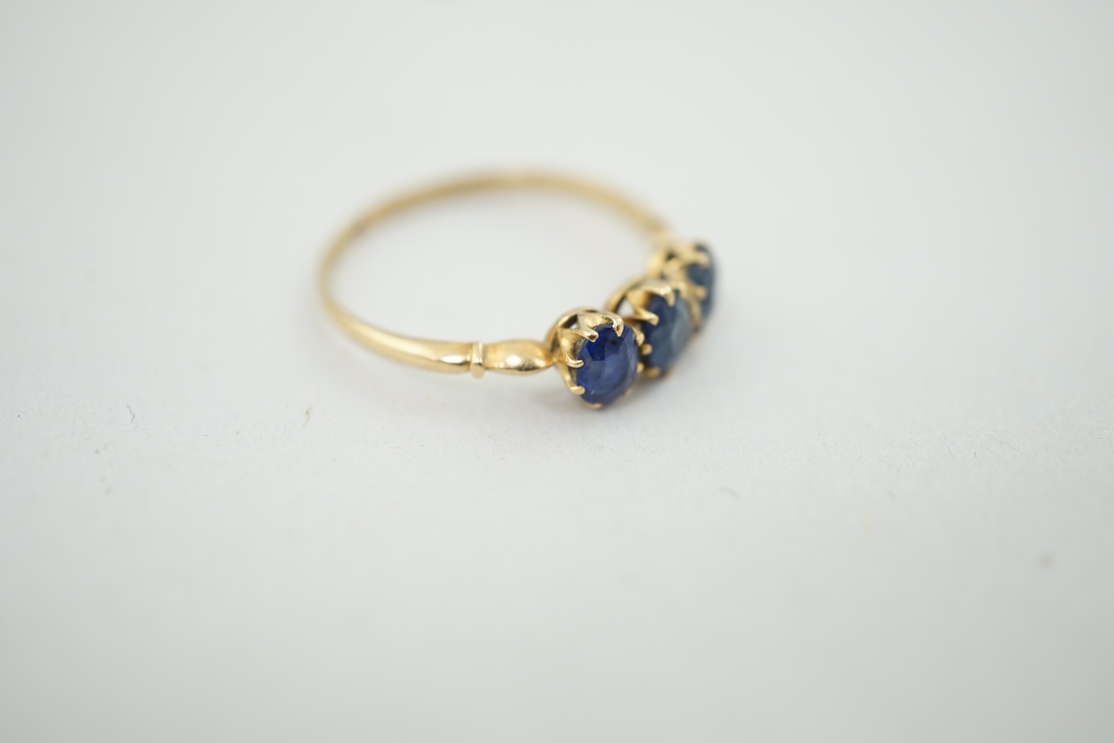 A late Victorian 18ct gold and three stone oval cut sapphire set ring